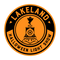 Logo for Lakeland Halloween Light Show with a train and ghost design on an orange background.
